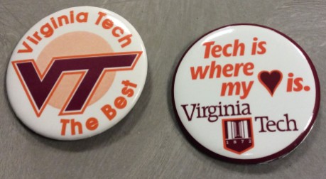 Buttons with the university logo and athletic logo